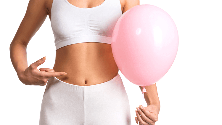 woman holding a pink balloon